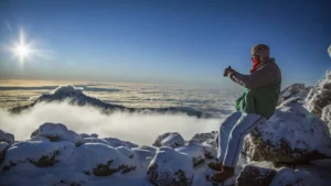 Best month to hike Kilimanjaro summit view with clear skies and snow-capped Uhuru Peak during optimal climbing season